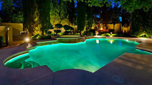 Modern above ground pool lighting ideas with LED lights illuminating a backyard pool at night